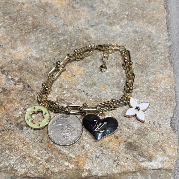Gold Charm Bracelet with LV Heart and Flower Accents - Picture 3 of 4